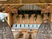 Comfortable seating area with hanging chairs